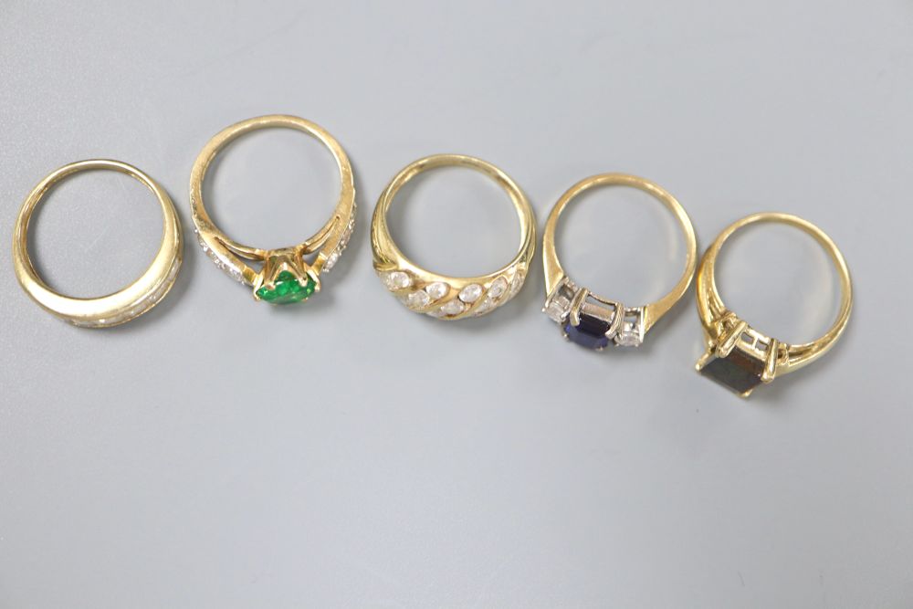 Five assorted 585 gold dress rings, one opal-set, the others paste-set, gross 13.4 grams.